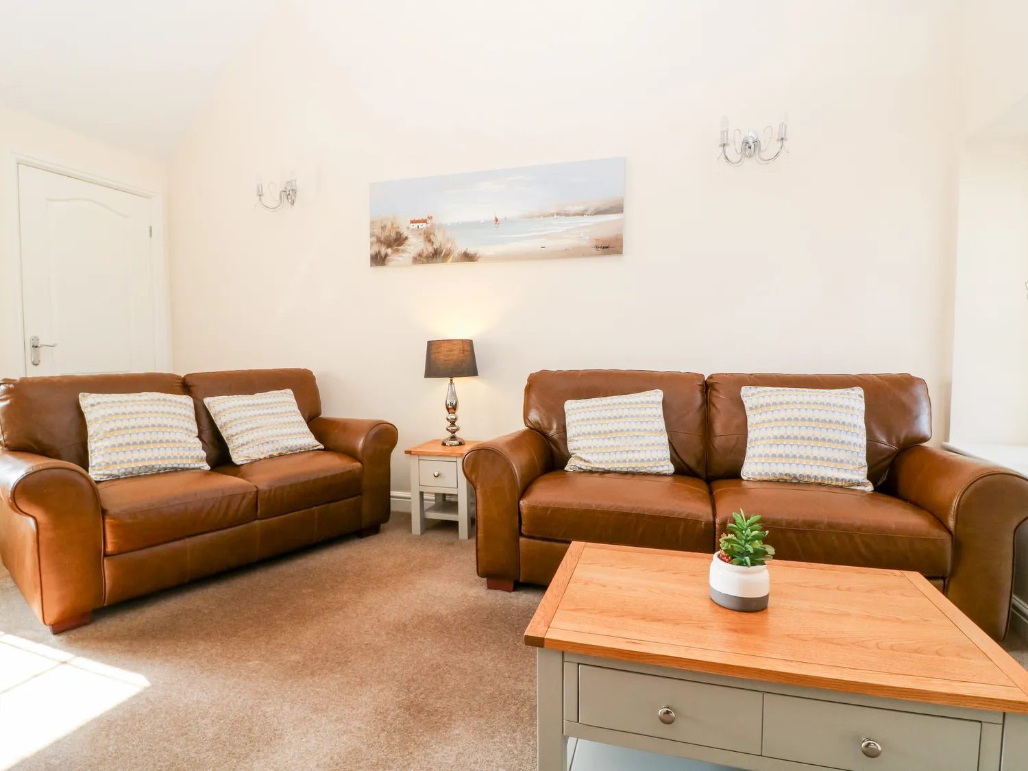 Two leather sofas and a coffee table